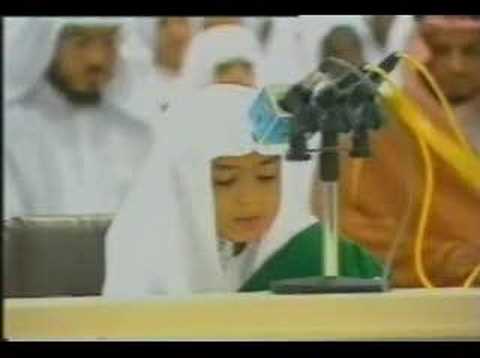 A young brother recites part of Surah al-Ambiya.